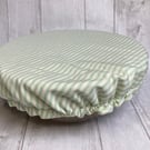 One extra large reusable bowl cover to fit a mixing bowl. Sage green stripes