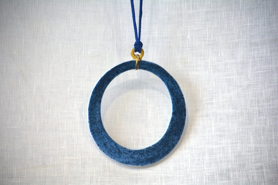 Porcelain pendant with gold leaf detail