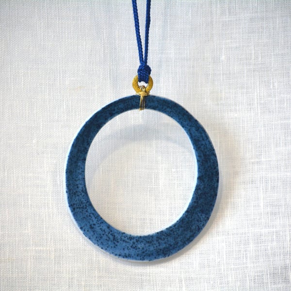 Porcelain pendant with gold leaf detail