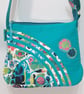 Small turquoise handbag with abstract flowers 