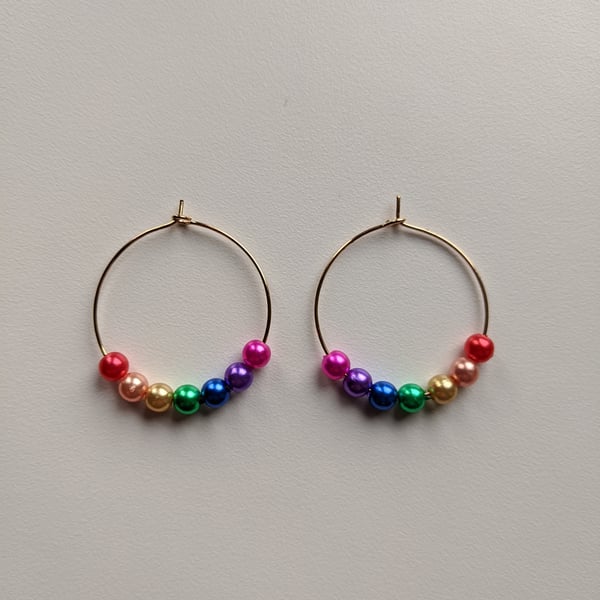 Bright rainbow bead hoops