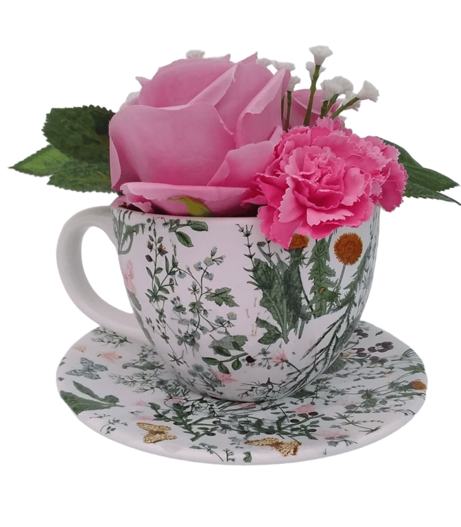 Pink roses and carnations arrangement in a decoupaged teacup and saucer 