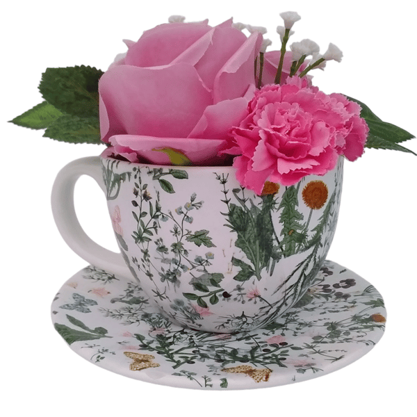 Pink roses and carnations arrangement in a decoupaged teacup and saucer 