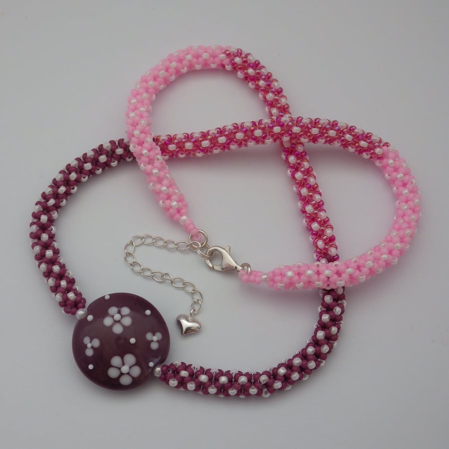 Purple and pink spotty beadwoven necklace with UK lampwork glass lentil bead