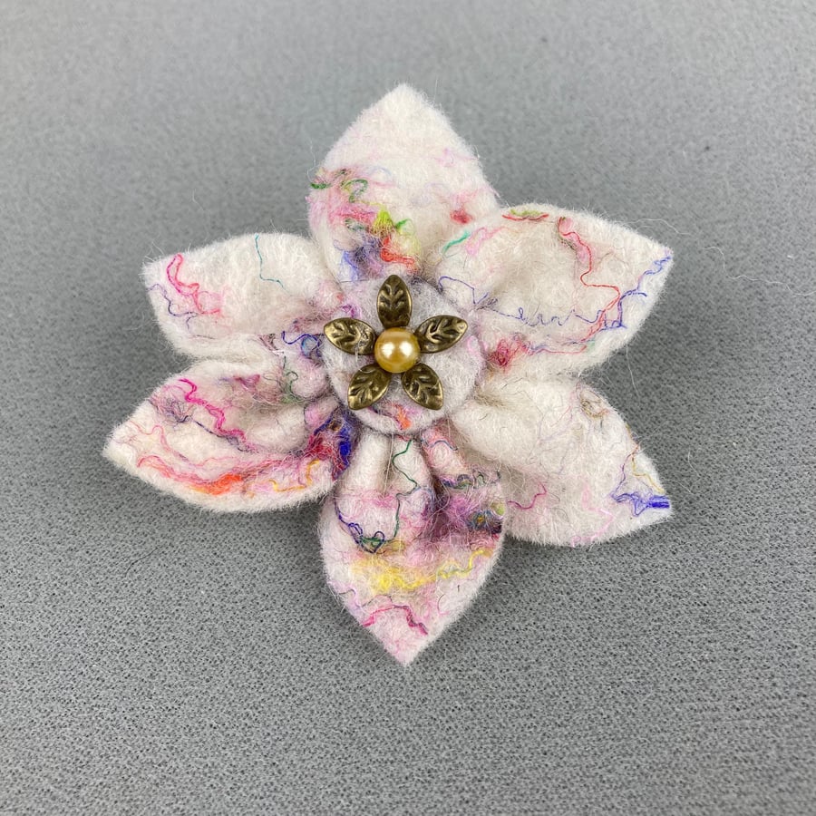 White felt flower brooch with coloured silk highlights