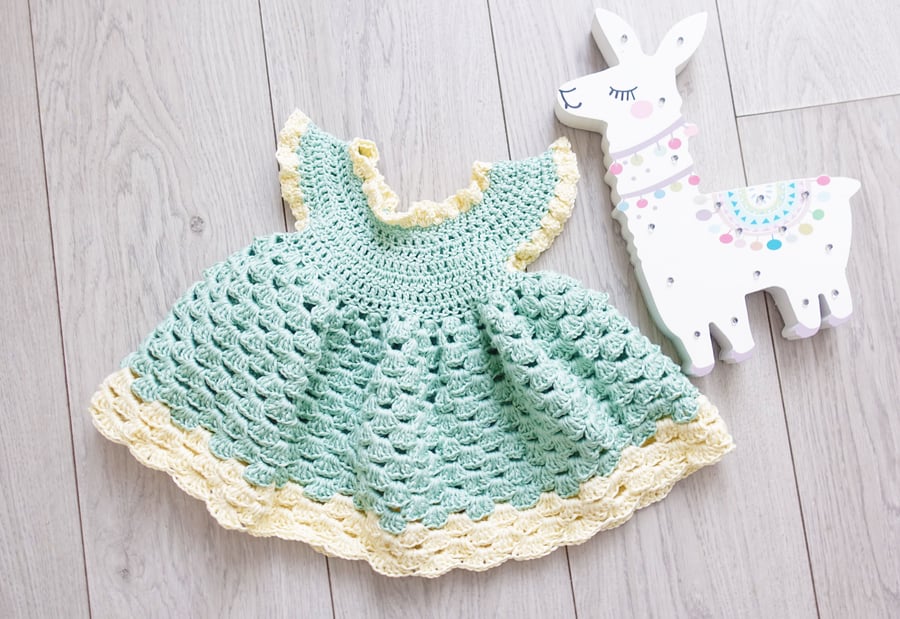 Crochet Mint and Buttermilk dress for child aged 3 to 12 months.
