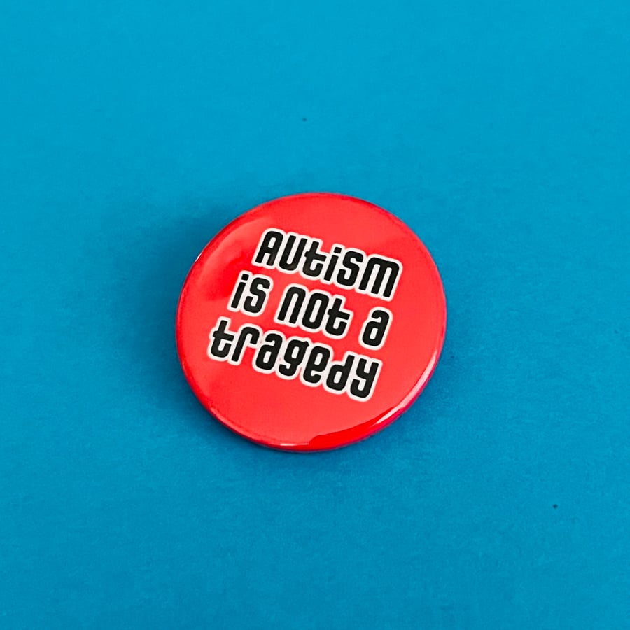 Autism is not a tragedy badge, pocket pebble, magnet or keyring.