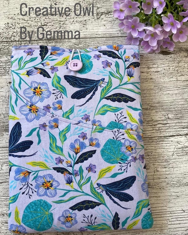 Fabric book sleeve with pocket for paperback books. Padded and fully lined. Hand