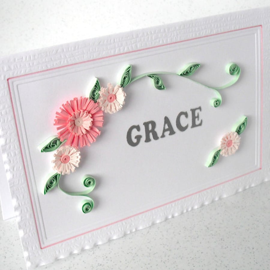 Quilled birthday card with name and flowers