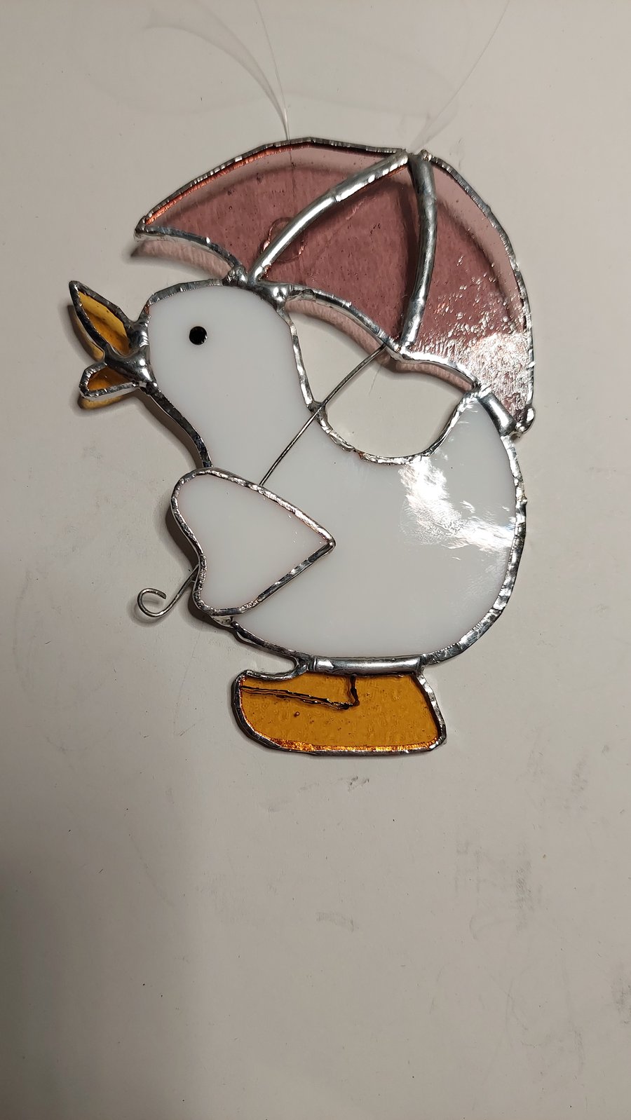 White duck and umbrella 