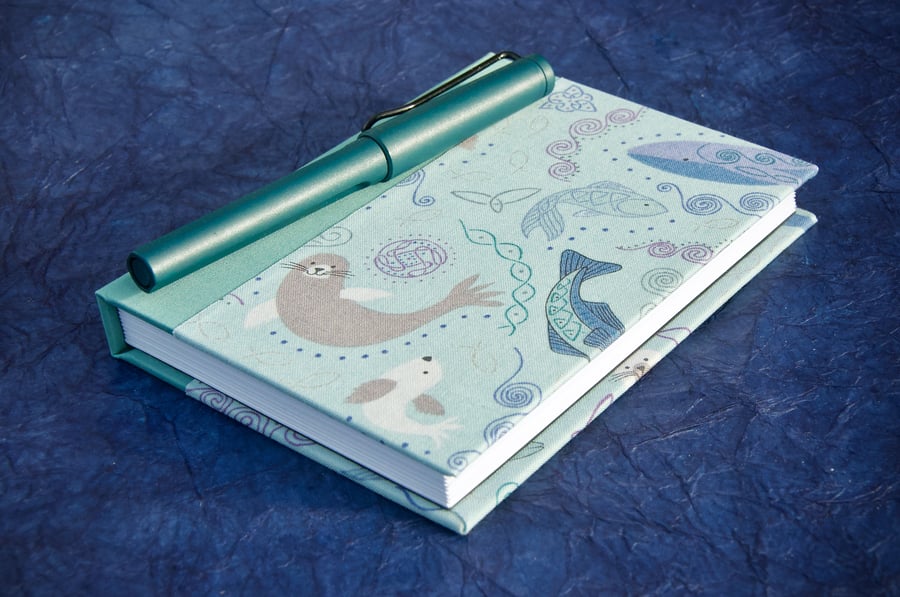 A6 Lined Notebook with smiley sea creatures fabric cover