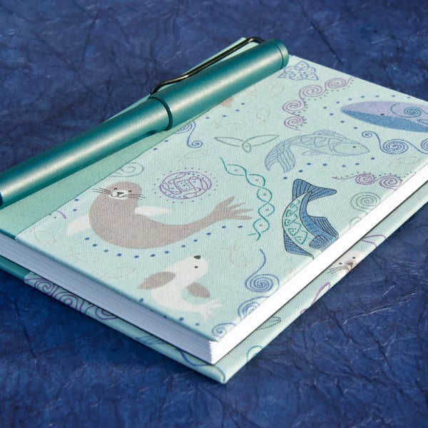A6 Lined Notebook with smiley sea creatures fabric cover