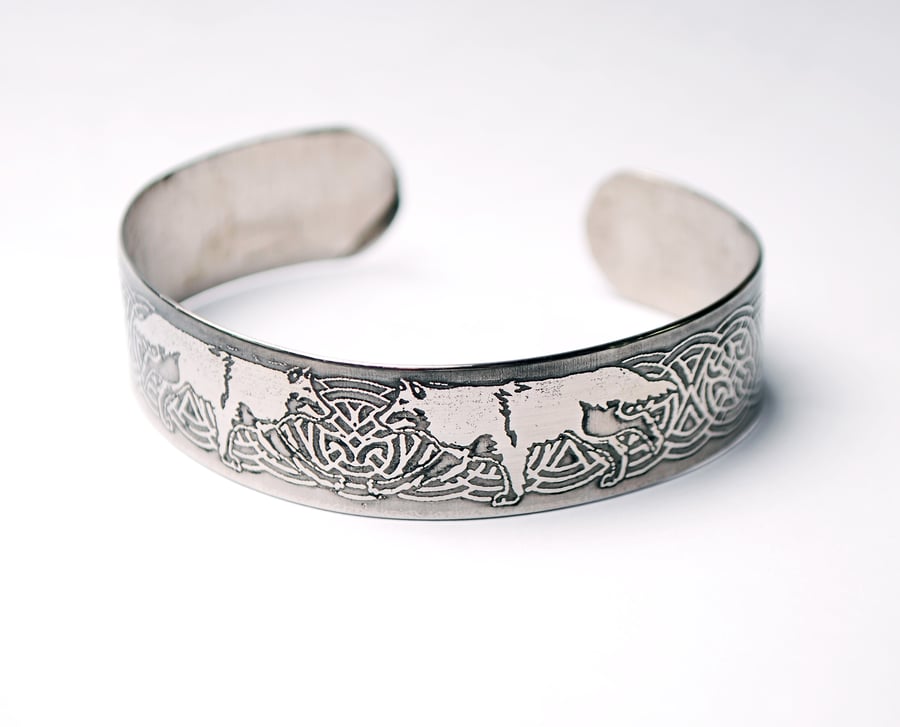Steel wolf bracelet with celtic knot detail