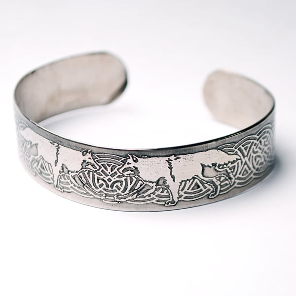 Steel wolf bracelet with celtic knot detail