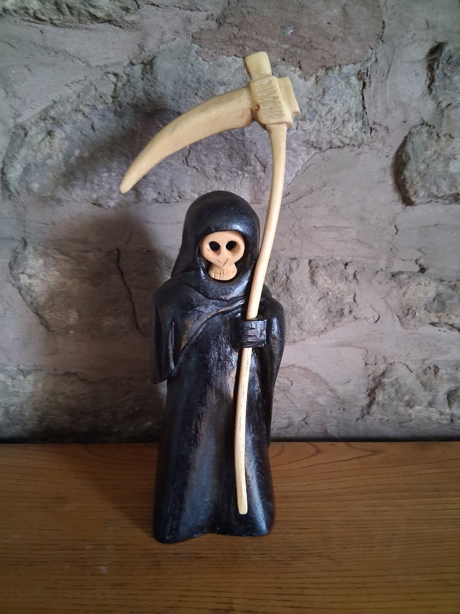 carved wooden Grim Reaper