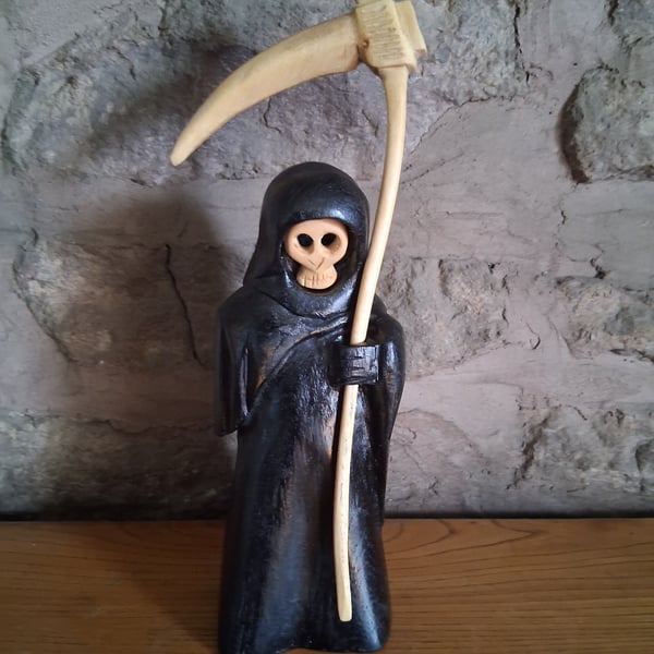 carved wooden Grim Reaper