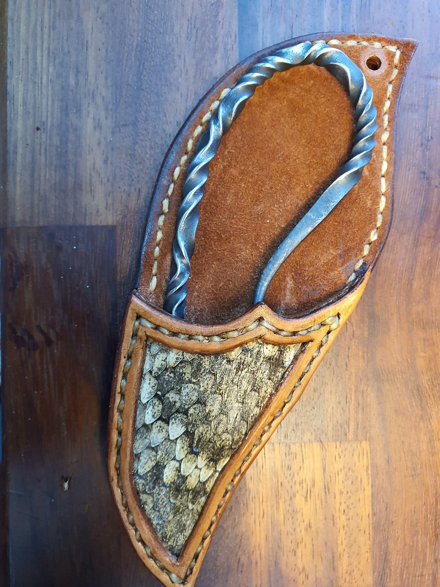 Bottle opener and leather sheath.