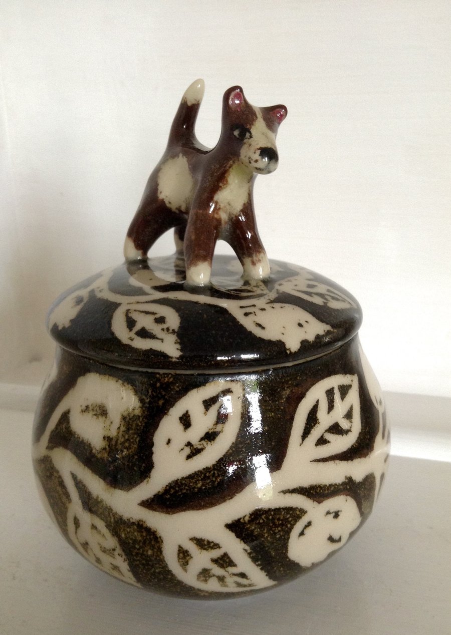 Storage jar with dog lid