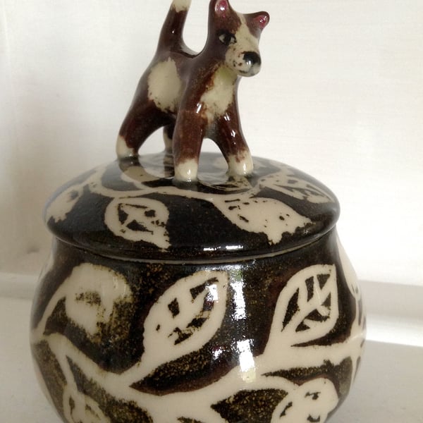 Storage jar with dog lid