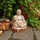 Hand-carved Laughing Buddha made from pressed wood pieces