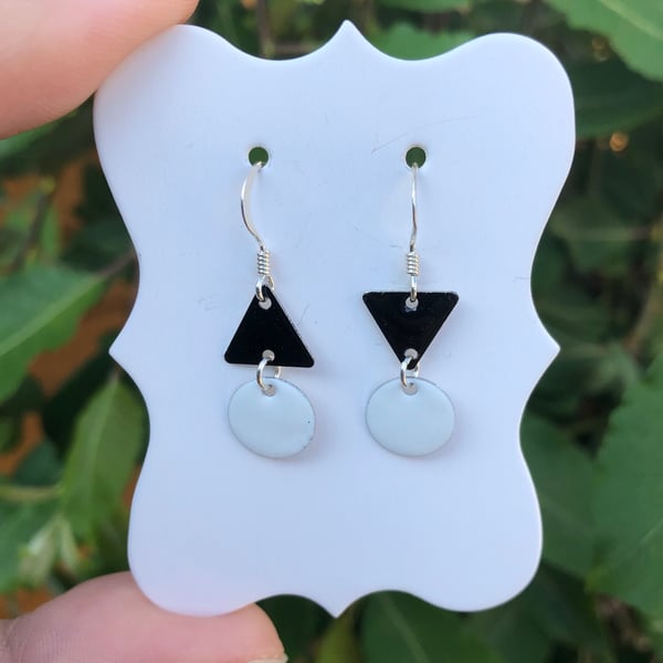 Topsy-turvy Hand enamel earrings. Black and white enamel earrings. 
