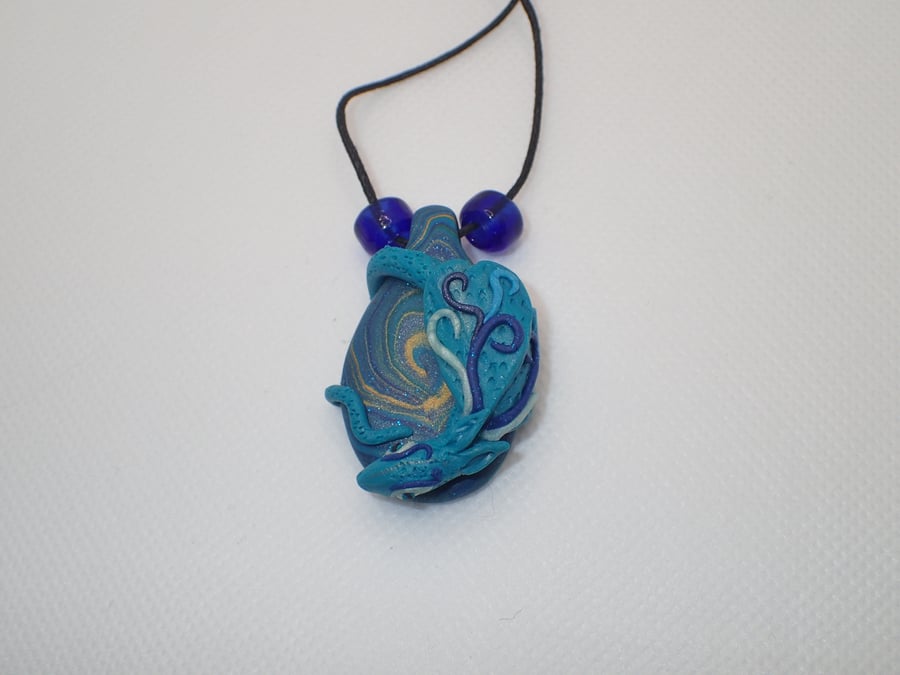 Blue polymer clay dragon pendant