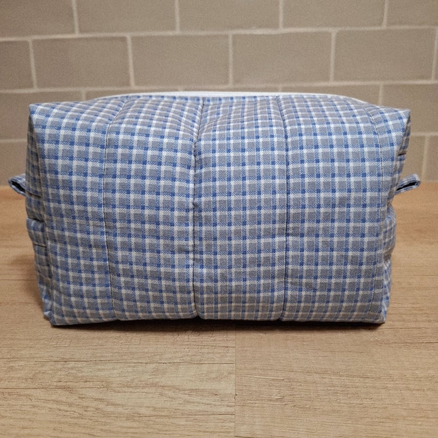 Boxed toiletry bag in blue and white checks 