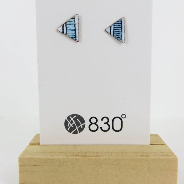 Triangle stud enamels in copper and enamel with hand drawn detail.