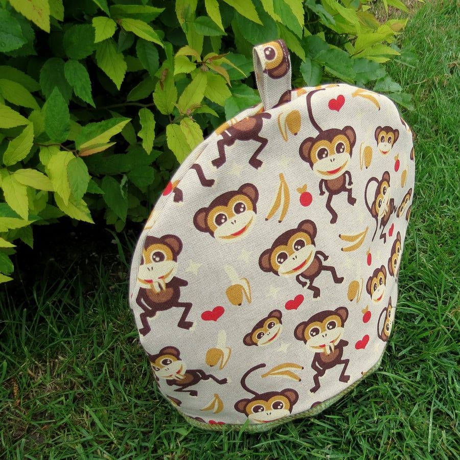 Large tea cosy.  A tea cosy with a monkeys design. To fit a 4-5 cup teapot.