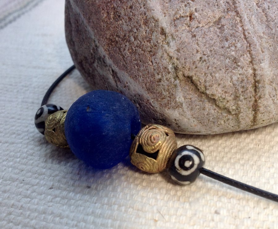 Blue surfer necklace with giant African glass, brass and Asian prayer beads