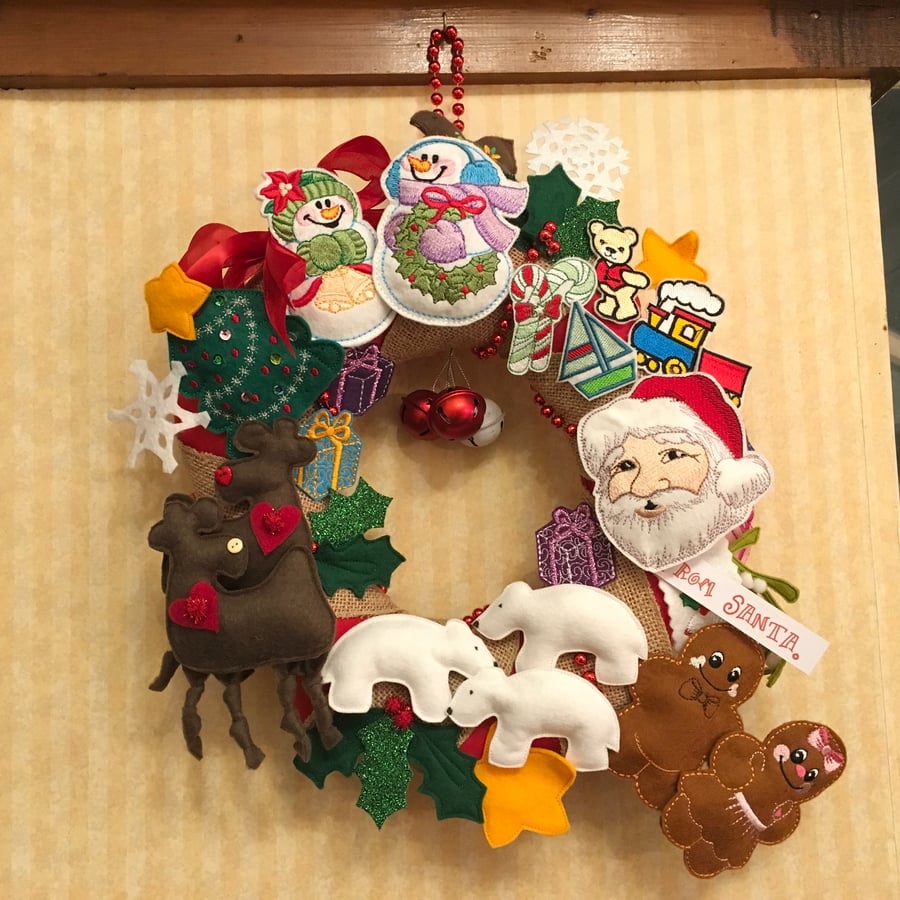 SAVE 25.00 ! Christmas Wreath full of Characters and colour changing LED light.