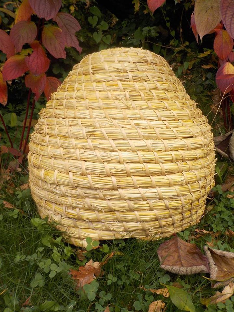 Medieval Bee-skep (classical British shaped straw Bee hive), bees, garden, hive