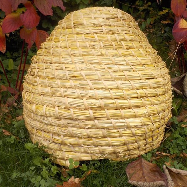 Medieval Bee-skep (classical British shaped straw Bee hive), bees, garden, hive