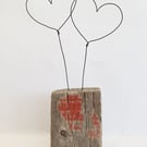 'Together driftwood with wire hearts