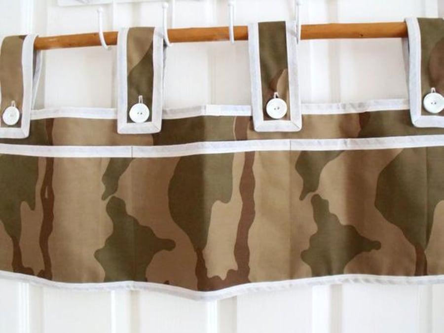 brown hanging bunk bed tidy with pockets to store books, controllers, toys etc