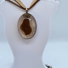 Brown Sea Glass Oval Pendant Set In Resin