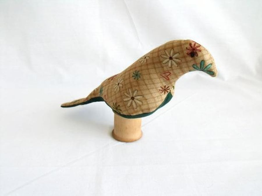 novelty bird ornament or bird pin cushion on a vintage wooden bobbin, beige