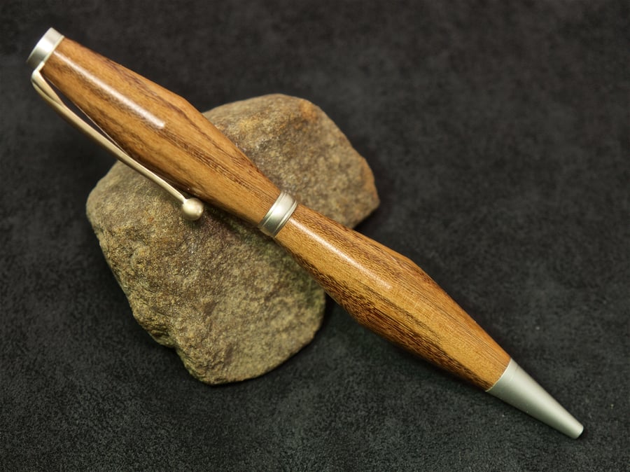 Hand made yew wood twist-pen. R5,1
