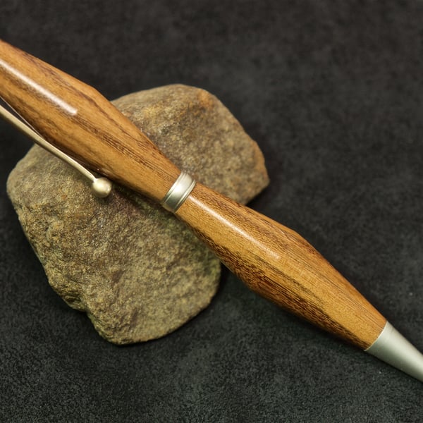 Hand made yew wood twist-pen. R5,1