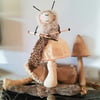 Mohair knitting bug on a linen mushroom soft sculpture