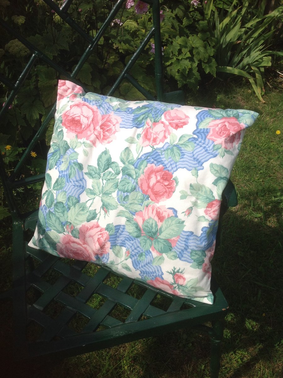 Pink and blue floral cushion