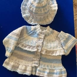 Frilled baby cardigan with matching mop cap