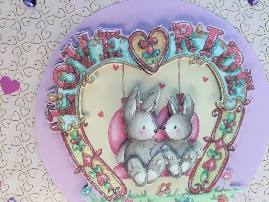 A lovely congratulations card with bunnies in love.