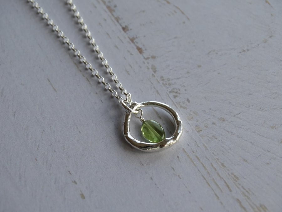 Silver and peridot hoop pendant - molten recycled sterling silver