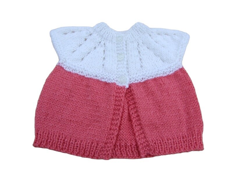 Baby sleeveless cardigan hand knitted in white and deep pink