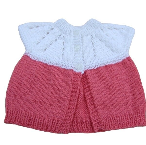 Baby sleeveless cardigan hand knitted in white and deep pink