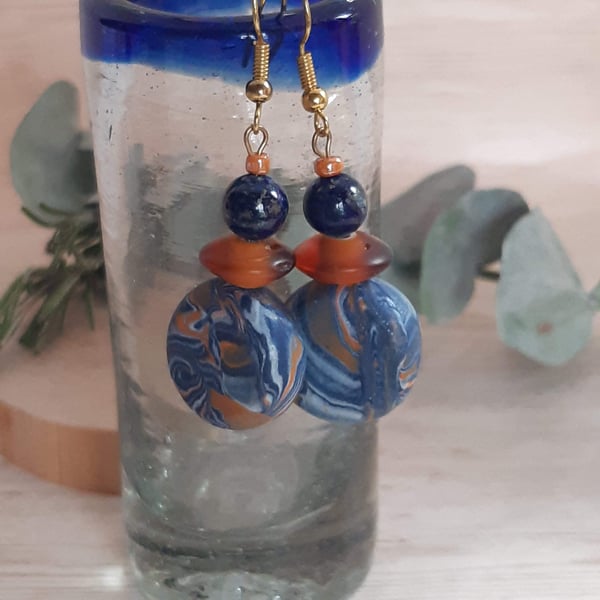 Polymer clay dangly disc earring with a hint of sparkle