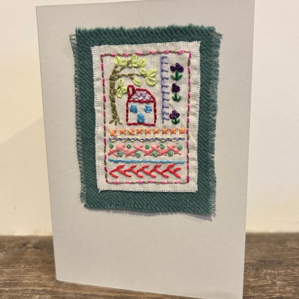 Handmade card sampler embroidery with a house, tree and flowers