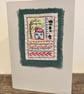 Handmade card sampler embroidery with a house, tree and flowers