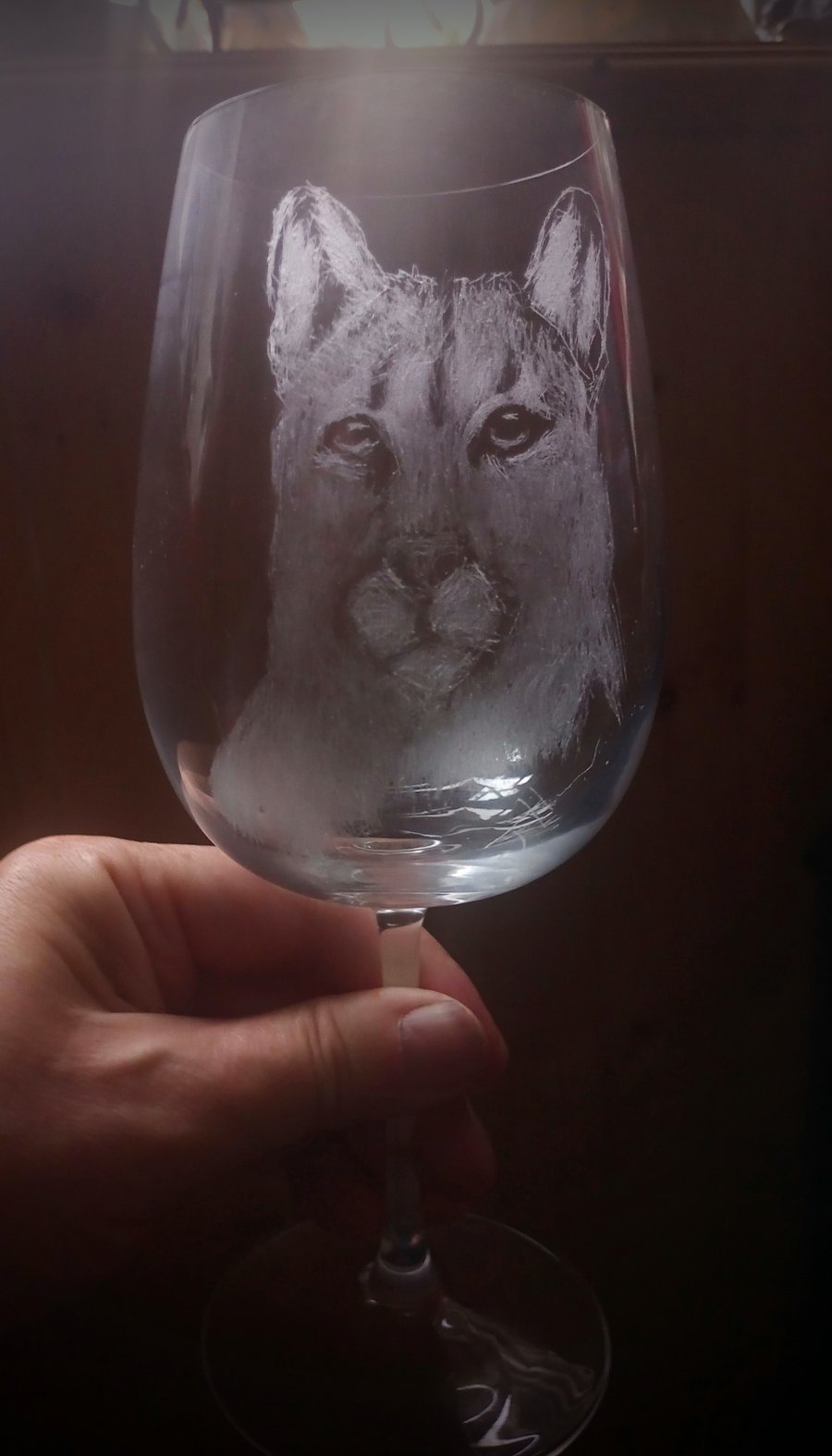 Puma on a wineglass